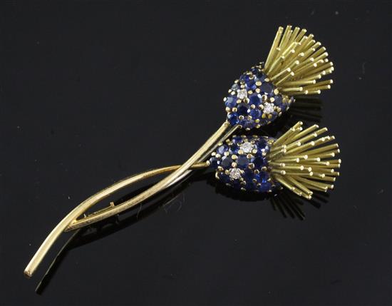An 18ct gold, sapphire and diamond flower brooch, 3in.
